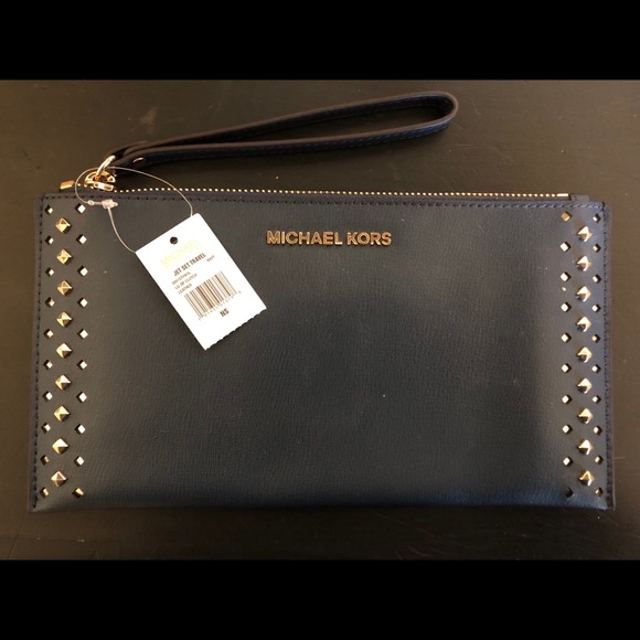 Michael Kors Handbags - Michael Kors studded navy blue wristlet clutch